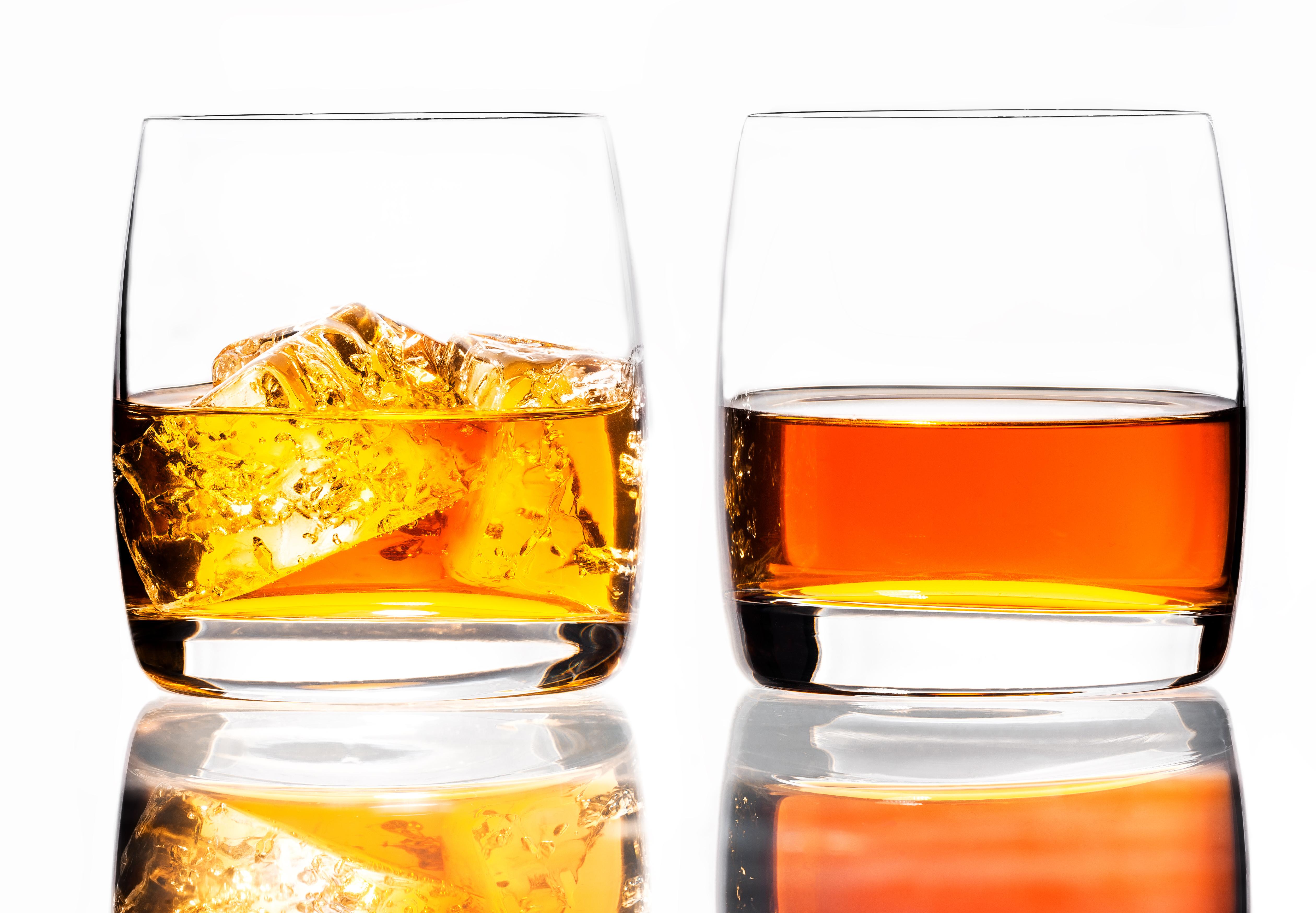 Two glasses of scotch whiskey and ice